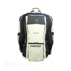 A black and beige Dainese D-Explorer adventure motorcycle jacket, size 58, in very good condition. Features an advanced modular flap system for ventilation, pockets for shoulder, elbow, and back protectors, and a removable rear exhaust vent. The jacket includes a replaceable country flag patch.