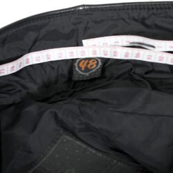 A pair of black Hein Gericke Streetline leather motorcycle pants, size 48 (85 cm waist), in good condition. Features a classic café-racer style with foam knee protectors. Hip protectors have been removed, leaving visible stitch holes but not affecting function.