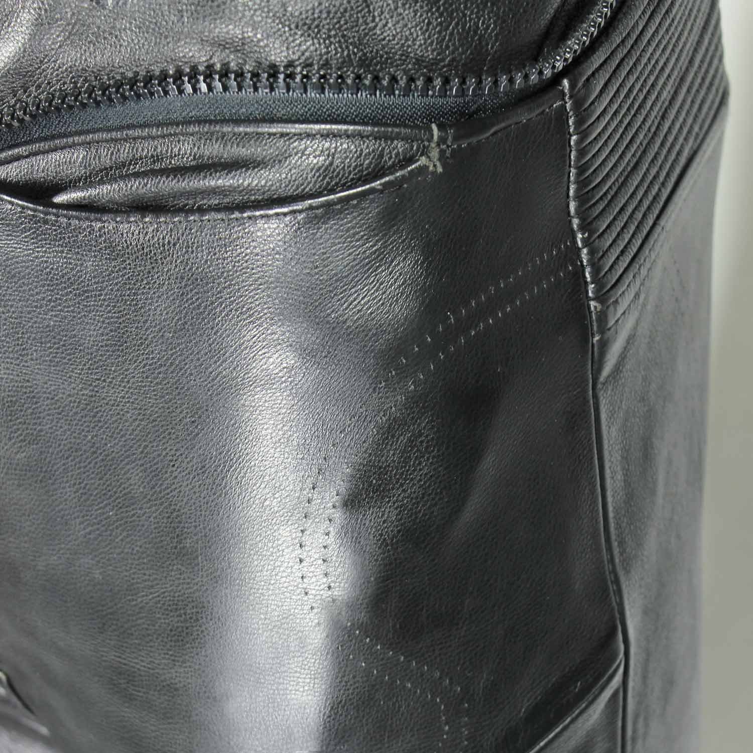 A pair of black Hein Gericke Streetline leather motorcycle pants, size 48 (85 cm waist), in good condition. Features a classic café-racer style with foam knee protectors. Hip protectors have been removed, leaving visible stitch holes but not affecting function.