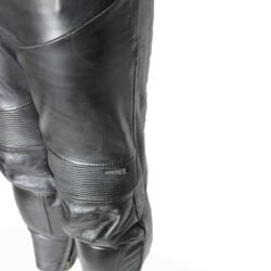 A pair of black Hein Gericke Streetline leather motorcycle pants, size 48 (85 cm waist), in good condition. Features a classic café-racer style with foam knee protectors. Hip protectors have been removed, leaving visible stitch holes but not affecting function.