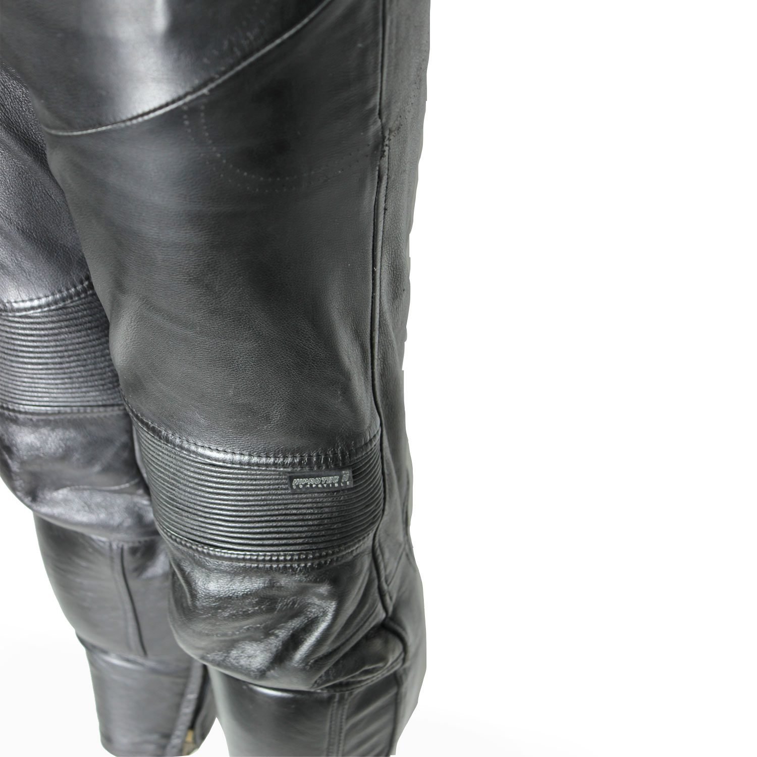 A pair of black Hein Gericke Streetline leather motorcycle pants, size 48 (85 cm waist), in good condition. Features a classic café-racer style with foam knee protectors. Hip protectors have been removed, leaving visible stitch holes but not affecting function.