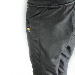 A pair of black IXS waterproof textile motorcycle pants, size L (91 cm stretch waist), in like-new condition. Features a Gore-Tex membrane, knee and hip protectors, and a full-length connection zipper for a riding jacket.