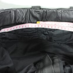 A pair of black Louis leather motorcycle trousers, size XL/27 (107 cm stretch waist), in good condition. Features a café-racer and street style with foam knee and hip protection, a full-length jacket connection zipper, a matching leather belt, and high-quality cowhide construction.