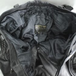A pair of black Louis leather motorcycle trousers, size 62 (100 cm stretch waist), in very good condition. Features a café-racer and street style with foam knee and hip protection, a full-length jacket connection zipper, and high-quality cowhide construction.
