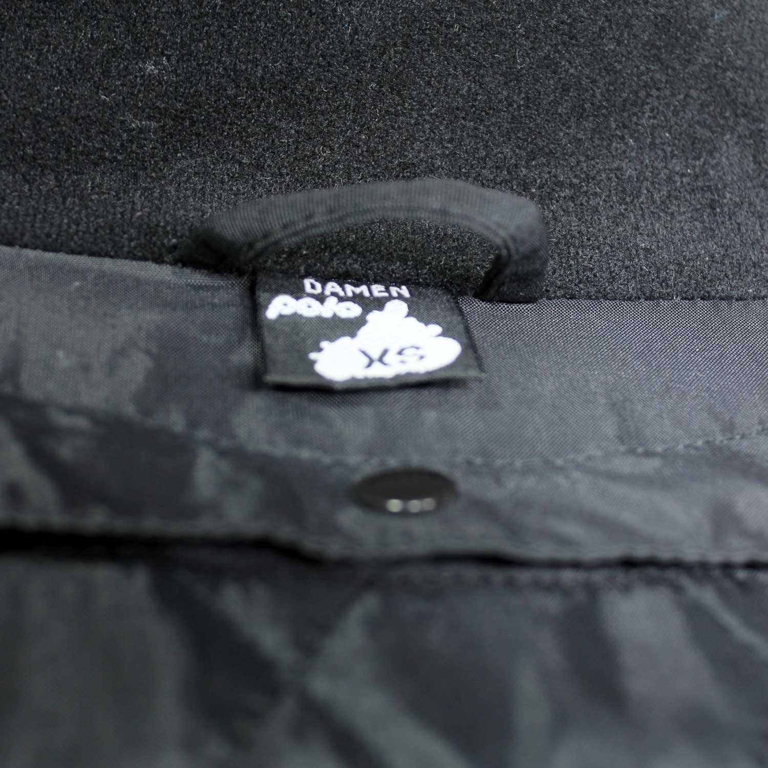 A black and blue Polo Competition R women's leather motorcycle jacket, size 36, in very good condition. Features a snug racing fit, shoulder, elbow, and back protectors, reflective stripes, and a connection zipper for track days or street riding.