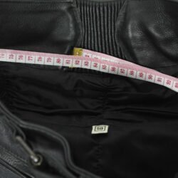 A pair of black Polo leather motorcycle trousers, size M 50 (82 cm stretch waist), in very good condition. Features a café-racer style with high-quality perforated cowhide for ventilation, foam knee and hip protection, and a full-length jacket connection zipper.