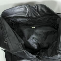 A pair of black Polo leather motorcycle trousers, size M 50 (82 cm stretch waist), in very good condition. Features a café-racer style with high-quality perforated cowhide for ventilation, foam knee and hip protection, and a full-length jacket connection zipper.