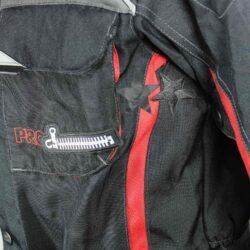 A black and red Probiker waterproof and breathable touring and adventure jacket, size M, in good condition. Features a climate membrane and shoulder protectors. Shows wear and includes professional repair patches in some areas (see product photos)