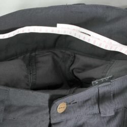A pair of black Spidi textile motorcycle pants, size 50 (93 cm waist), in very good condition. Features a lightweight design for good weather riding, knee protectors, and reflectors for visibility.