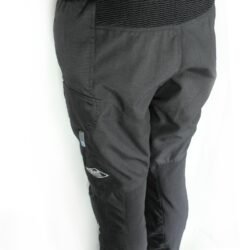 A pair of black Vanucci waterproof touring and adventure motorcycle trousers, size L (100 cm waist), in very good condition. Made of durable textile with a SympaTex membrane, includes knee protectors, and features both short and full-length jacket connection zippers.