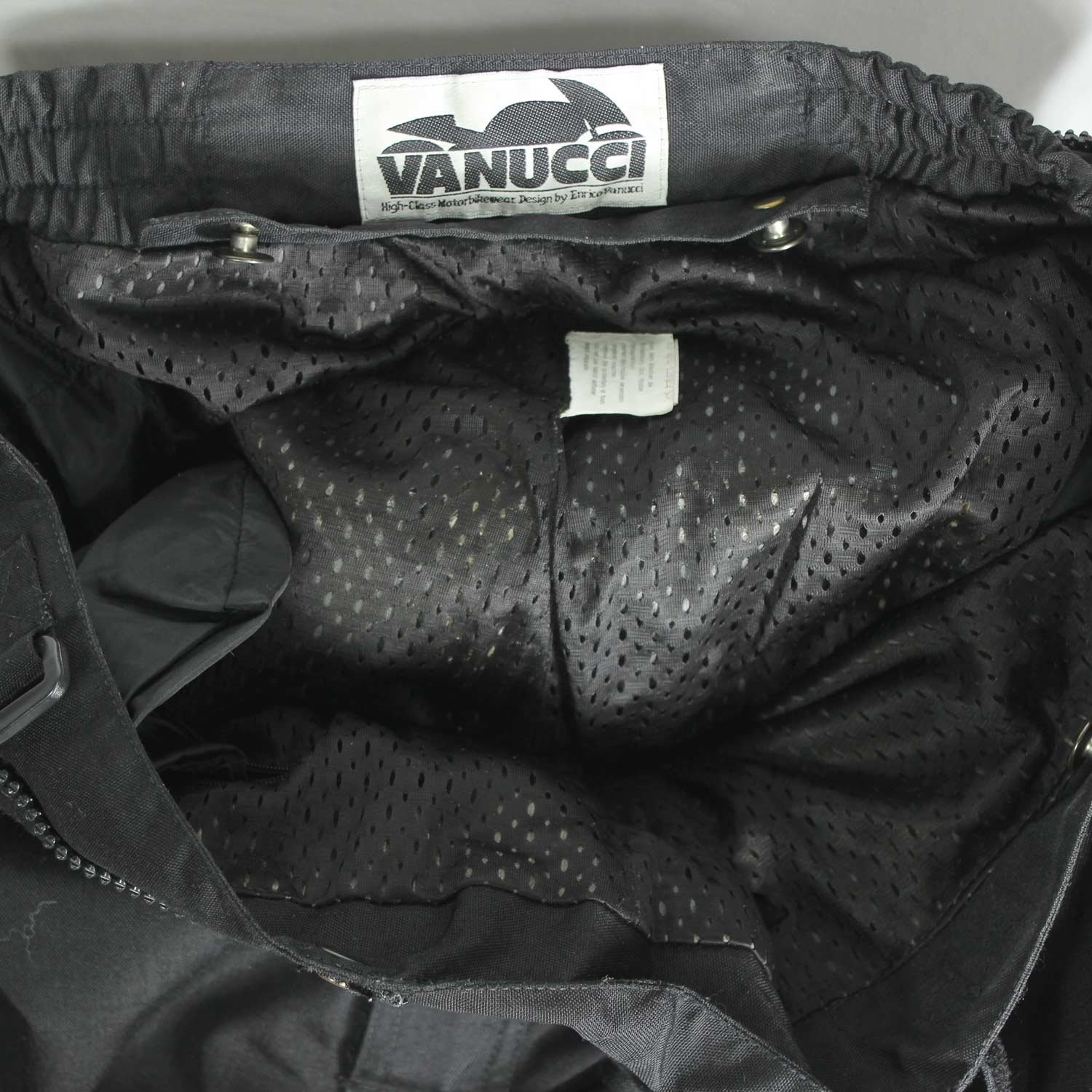 A pair of black Vanucci waterproof touring motorcycle trousers, size XL, in very good condition. Made of durable textile with a SympaTex membrane and features both short and full-length jacket connection zippers. Pockets for knee and hip protectors are included (protectors not provided)