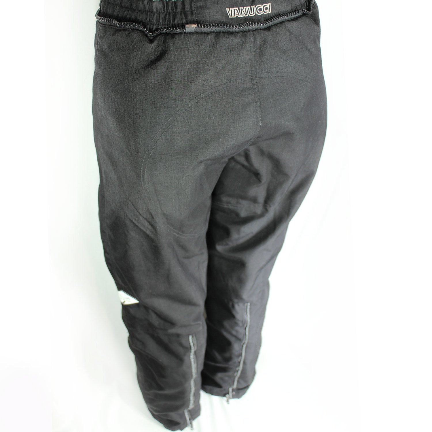 A pair of black Vanucci waterproof touring motorcycle trousers, size XL, in very good condition. Made of durable textile with a SympaTex membrane and features both short and full-length jacket connection zippers. Pockets for knee and hip protectors are included (protectors not provided)