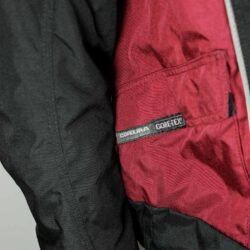 A black and red YOKO vintage-style motorcycle jacket, size XL, in very good condition. Features durable Cordura textile, a GoreTex waterproof membrane, and CE-rated shoulder and elbow protectors, blending unique vintage style with modern protection.