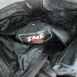 A pair of black ZME Racing leather motorcycle pants, size XXL/28 (91 cm waist), in very good condition. Features a racing and café-racer style with foam protectors at the knees and hips.
