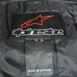 A black and white Alpinestars Jaws sport racing leather jacket, size 56 (XL-XXL, 110-114 cm chest), in good condition. Features premium perforated full-grain leather, CE-certified shoulder, elbow, and back protectors, a removable thermal liner, and adjustable fit with professional repairs visible.