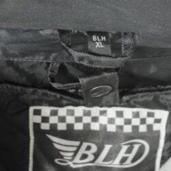 A black BLH all-season textile motorcycle jacket, size XL, in good condition. Features a waterproof climate membrane, removable thermal liner, CE-rated protection for shoulders, elbows, and back, and reflective stripes for visibility during touring and street riding.