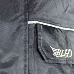 A black BLH all-season textile motorcycle jacket, size XL, in good condition. Features a waterproof climate membrane, removable thermal liner, CE-rated protection for shoulders, elbows, and back, and reflective stripes for visibility during touring and street riding.