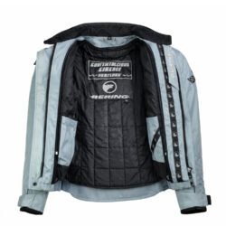 A light blue Bering Continental Circus Heritage women's vintage racing-style textile jacket, size T3, in fairly good condition. Features a short roadster cut with durable nylon and polyester construction, shoulder, elbow, and back protectors, and a decorative back patch.