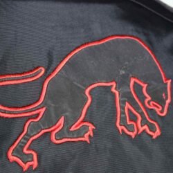 A black and red Furygan Titan sport racing textile jacket, size XL (105-112 cm chest), in good condition. Features a waterproof climate membrane, removable CE-approved D3O protectors at shoulders, elbows, and back, aluminum impact reinforcements, and a removable quilted thermal liner.