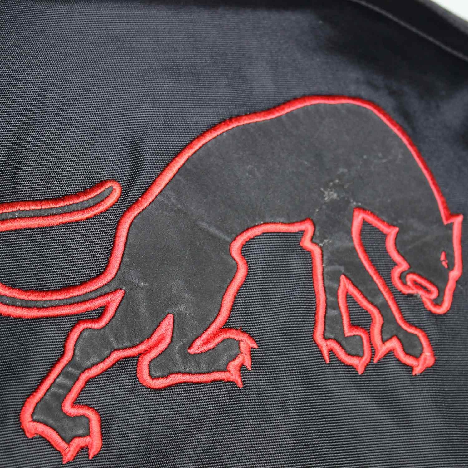 A black and red Furygan Titan sport racing textile jacket, size XL (105-112 cm chest), in good condition. Features a waterproof climate membrane, removable CE-approved D3O protectors at shoulders, elbows, and back, aluminum impact reinforcements, and a removable quilted thermal liner.