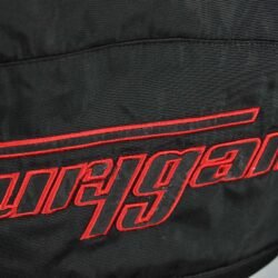 A black and red Furygan Titan sport racing textile jacket, size XL (105-112 cm chest), in good condition. Features a waterproof climate membrane, removable CE-approved D3O protectors at shoulders, elbows, and back, aluminum impact reinforcements, and a removable quilted thermal liner.