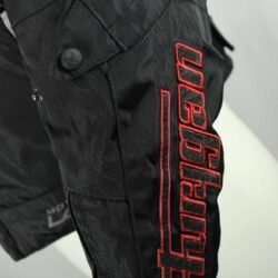 A black and red Furygan Titan sport racing textile jacket, size XL (105-112 cm chest), in good condition. Features a waterproof climate membrane, removable CE-approved D3O protectors at shoulders, elbows, and back, aluminum impact reinforcements, and a removable quilted thermal liner.