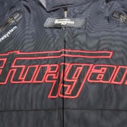 A black and red Furygan Titan sport racing textile jacket, size XL (105-112 cm chest), in good condition. Features a waterproof climate membrane, removable CE-approved D3O protectors at shoulders, elbows, and back, aluminum impact reinforcements, and a removable quilted thermal liner.
