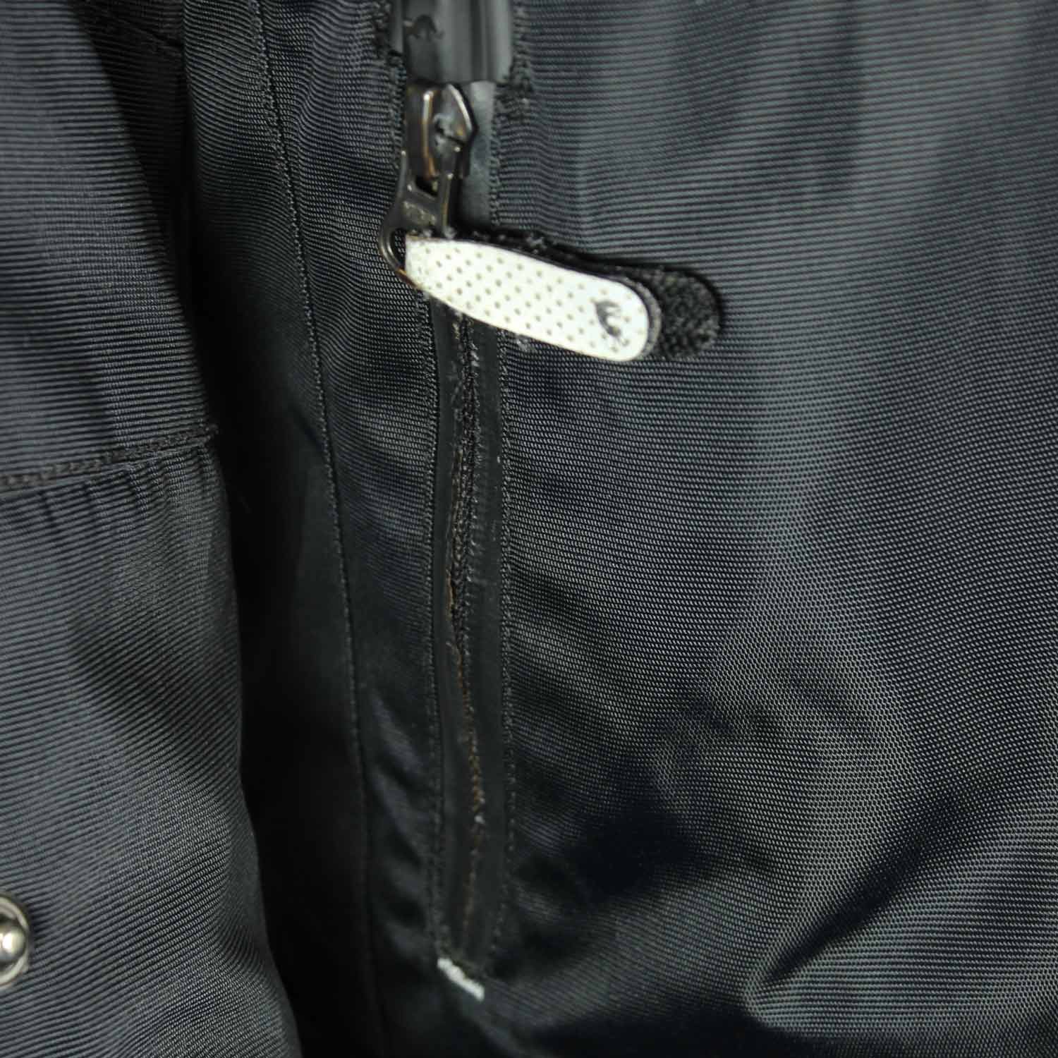 A black and red Furygan Titan sport racing textile jacket, size XL (105-112 cm chest), in good condition. Features a waterproof climate membrane, removable CE-approved D3O protectors at shoulders, elbows, and back, aluminum impact reinforcements, and a removable quilted thermal liner.