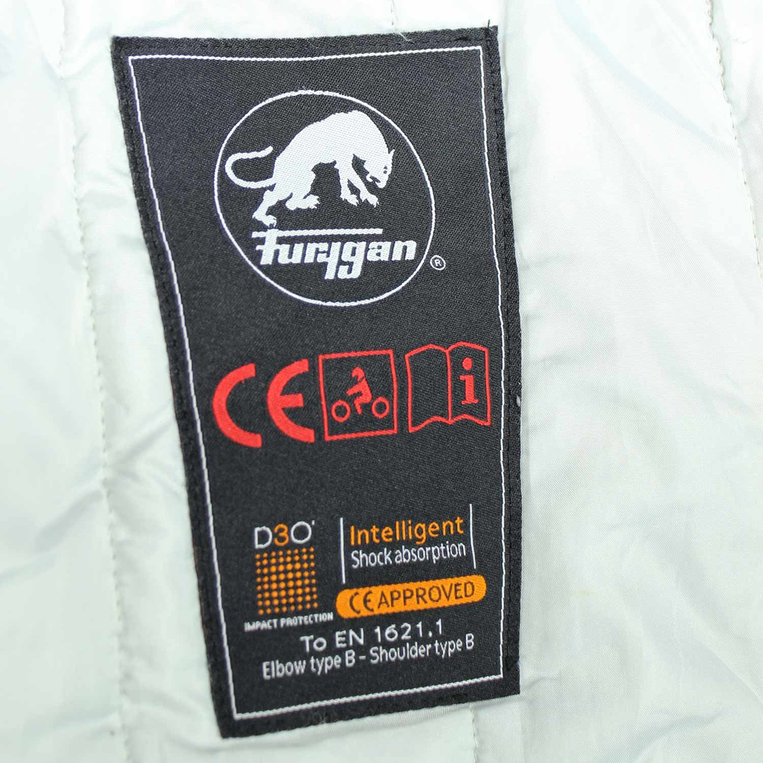 A black and red Furygan Titan sport racing textile jacket, size XL (105-112 cm chest), in good condition. Features a waterproof climate membrane, removable CE-approved D3O protectors at shoulders, elbows, and back, aluminum impact reinforcements, and a removable quilted thermal liner.