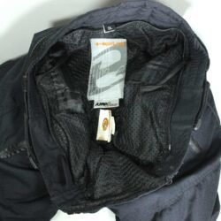 A pair of black Held women's adventure touring textile motorcycle pants, size DL, in very good condition. Features a waterproof climate membrane, abrasion-resistant fabric, and integrated knee and hip protectors.