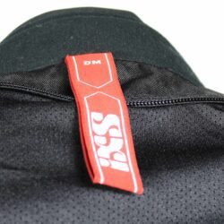 A black and white IXS Alana Evo women's touring and adventure textile motorcycle jacket, size DM, in very good condition. Features a waterproof Solto-TEX Z-liner membrane, CE-Level 1 shoulder and elbow protectors, and a removable thermal liner.