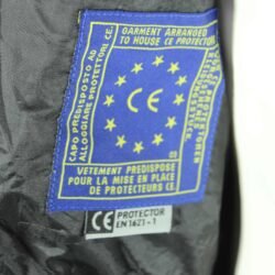 A black IXS touring and adventure textile motorcycle jacket, size M, in very good condition. Features a waterproof Solto-TEX Z-Liner membrane, multiple ventilation openings, 9 pockets including waterproof options, adjustable fit, and CE-rated shoulder, elbow, and back protectors