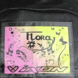 A grey Ixon Flora Mania women's summer mesh motorcycle jacket, size 2XL, in very good condition. Features Spytech polyester construction with mesh panels for ventilation, CE-certified shoulder and elbow protectors, a foam back protector, and multiple pockets.